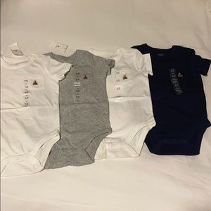FOUR Gap onesies sold together. Brand new.